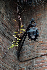 Ancient lamp in the yard of the Romeo and Juliet house in Verona, Italy
