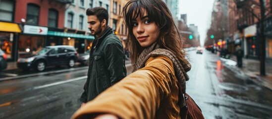 Young woman leading man through city street by hand, seen from her perspective. - obrazy, fototapety, plakaty
