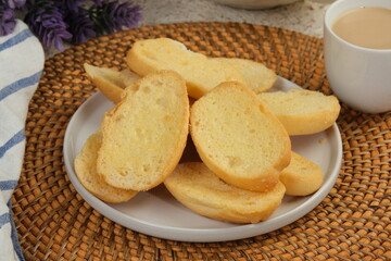 Obraz na płótnie Canvas Bagelen or roti bagelen is dried bread with Sugar Sprinkle and crunchy texture, Indonesian traditional snack