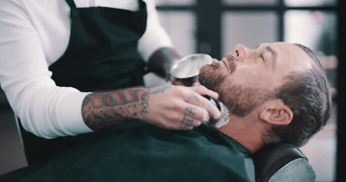 Barbershop people, beard cream and client cut for facial grooming, maintenance or hairdressing treatment. Hairdresser equipment, customer and barber hands with brush for shaving creme application