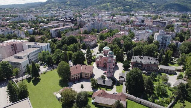 Aerial establishing shot of Serbian Orthodox Church of Holy Trinity, Circling shot, Banja Luka