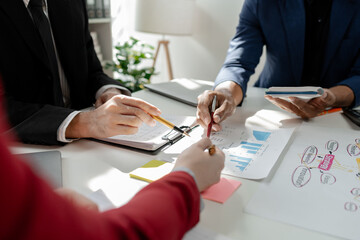 Financial accountant planner meeting business consultation introduction, Group of accountant persons talking in the office, businessperson's hand calculating invoice at workplace.