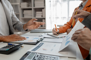 Calculate the numbers according to the report sent to the meeting, They are calculating the taxes they have to pay, They are having a meeting about the company's income and expenses,