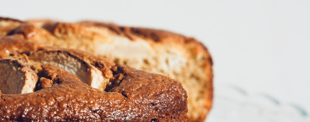 Homemade sliced fruit cake on white background. 