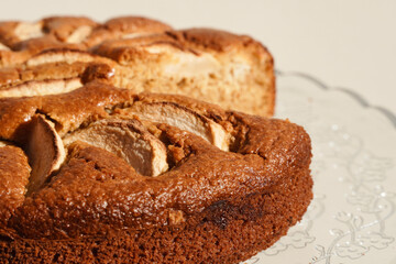 Homemade sliced fruit cake on white background. 