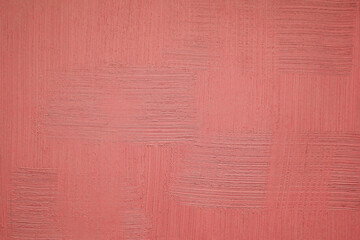 Light coral stucco background. Wallpaper of red plaster