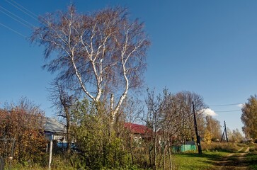 Old buildings in the village in autumn