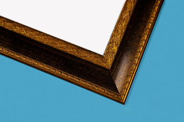 Antique wooden picture frame. Old rustic wooden frame. Antique carved gilded frame