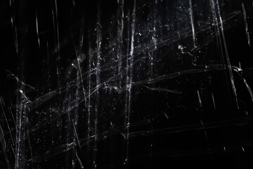 Abstract background. The shine of polyethylene. Synthetic glitter on black - obrazy, fototapety, plakaty