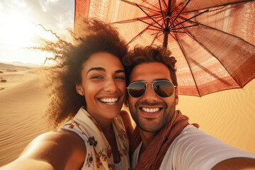 couple in desert having selfie with umbrella photo world premium image - obrazy, fototapety, plakaty