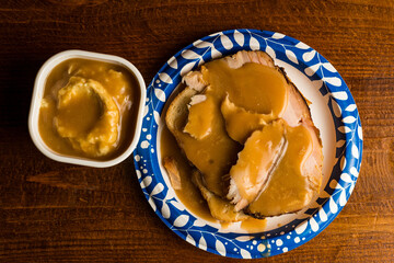 Open faced turkey sandwich with mashed potatoes and gravy