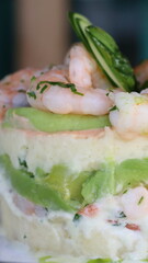 Causa rellena de langostinos, palta y papa, Causa stuffed with prawns, avocado and potato