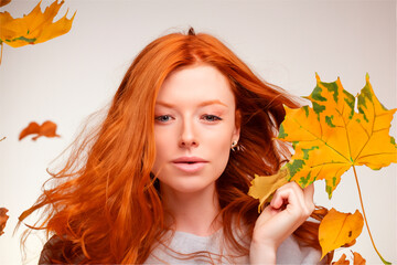 Naklejka na ściany i meble Woman with autumn leaves.Generative Al