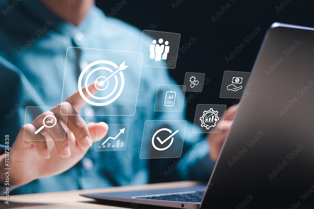Poster targeting business concept. businessman use laptop with target icons for business objective. strateg