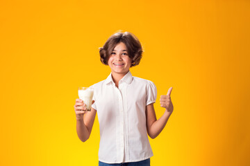 Child girl holding glass of milk. Nutrition and health concept