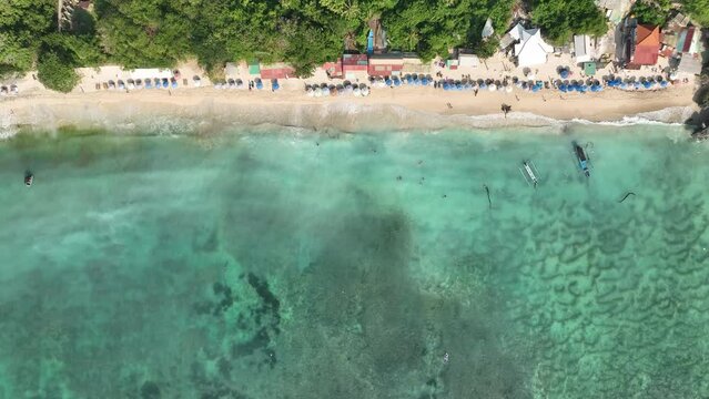top-down aerial shot thomas beach bali tranquil tropical island 4k