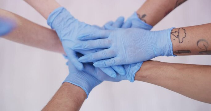 Top of hands stack, gloves for health and support in team with people for hygiene and wellness in studio. Healthcare, safety and protection with collaboration for solidarity on white background