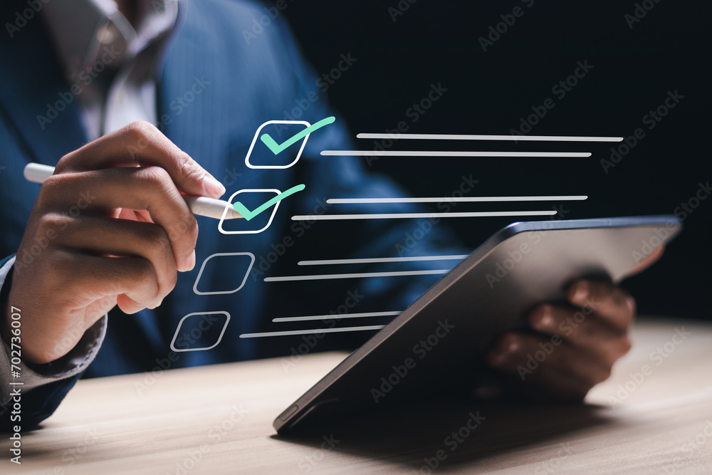 Poster business project approval concept. businessman use tablet with making correct sign mark on checkboxe