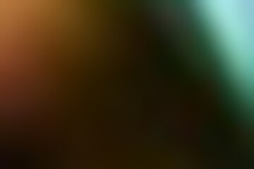 Abstract blurred background image of orange, green colors gradient used as an illustration. Designing posters or advertisements.