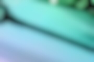 Abstract blurred background image of blue, green colors gradient used as an illustration. Designing posters or advertisements.
