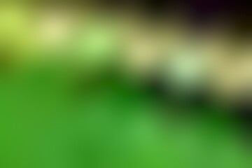 Abstract blurred background image of green colors gradient used as an illustration. Designing posters or advertisements.