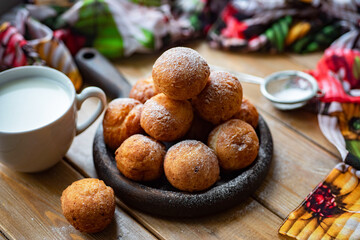 Delicious, sweet donuts for breakfast. Dessert for children: donuts with powdered sugar. Close-up