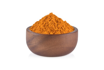 turmeric powder in wooden bowl isolated on white background