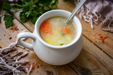 Chicken soup in a nice plate for lunch. Chicken soup on a plate for dinner. Close-up