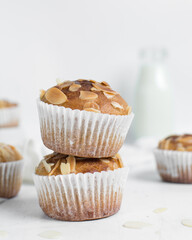 vanilla almond muffins on a white table, homemade bakery style almond muffins on a white background