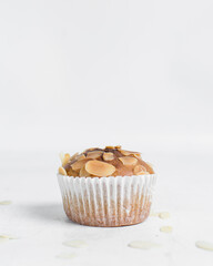 vanilla almond muffins on a white table, homemade bakery style almond muffins on a white background