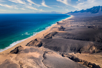 Aerial, panoramic view of the beautiful, unspoiled  Cofete beach on the volcanic island of Fuerteventura, Canary Islands, Spain.