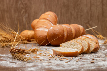Various types of savory bread including ciabatta baguette and whole grain displayed individually on