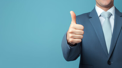 Businessman in suit showing thumb up on isolated blue background with space for copy