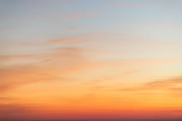 Selbstklebende Fototapeten Sky gradient from blue to orange sunset © EKKAPON