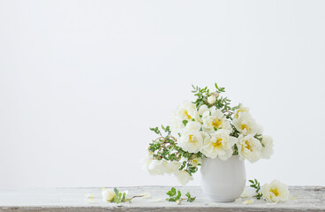 white roses in vase