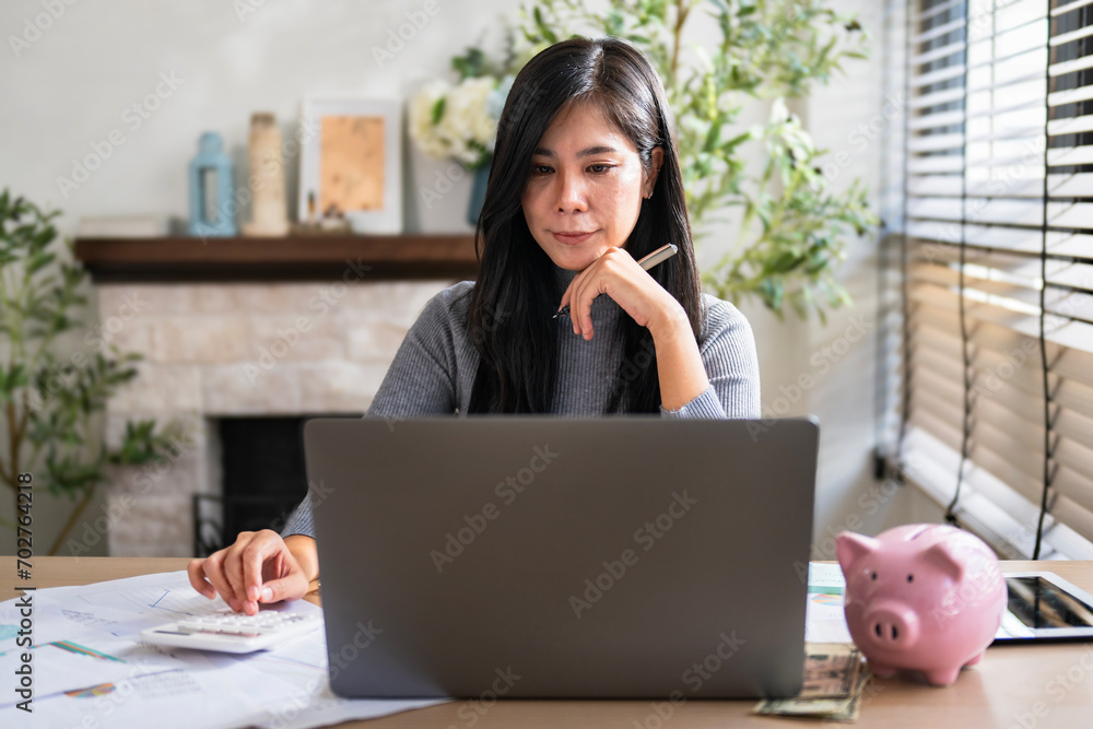 Poster female accountant using calculator and computer with pen in office. concept finance and accounting