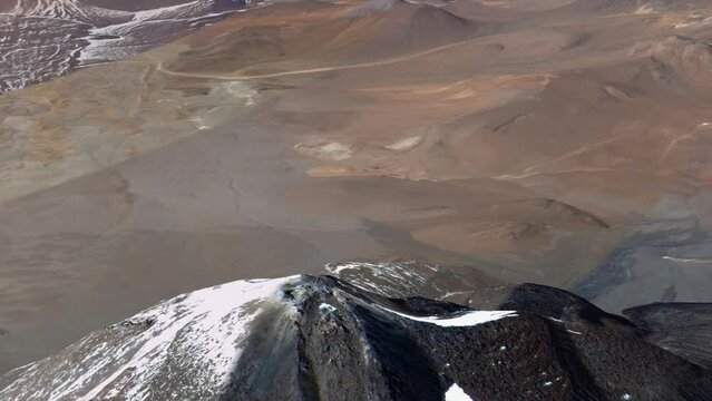 Aerial view of an active volcano orbiting around the peak Nature rock Crater