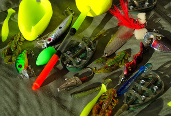 Fishing gear on a tarpaulin background.