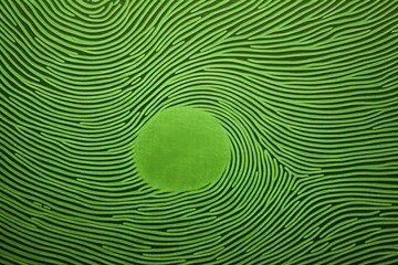  a green background with wavy lines and a circular hole in the center of the image is a green background with wavy lines and a circular hole in the center.