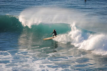 Professional surfer rides a wave in the ocean. Sopelana beach near Bilbao (Basque Country). Men...