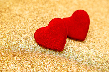 Heart symbol on a gold shiny background
