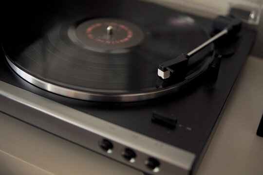 turntable with vinyl playing indoors