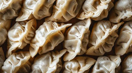Overhead shot of Lots of Steamed Chinese dumplings, pork dim sum chilli sauce eastern Traditional cuisine