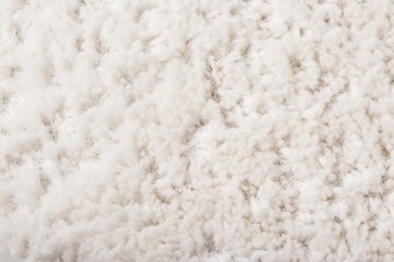  a close up of a textured white carpet with a black stripe on the bottom of the rug and a black stripe on the bottom of the rug.