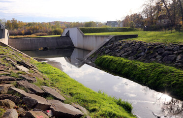 Cracow, Malopolska, Poland - 10.24.2022: A small dam on a local river.