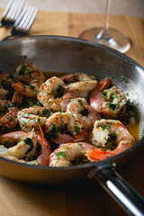 Fried langoustines, shrimp in white wine with garlic and parsley