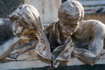 Fototapeta na wymiar Cimitero Monumentale, historic cemetery in Milan, Italy. A tomb
