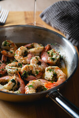 Fried langoustines, shrimp in white wine with garlic and parsley