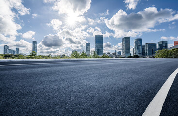 Empty asphalt road and city buildings skyline in Shenzhen