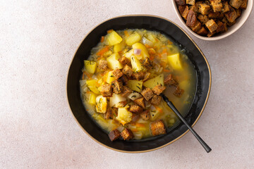 Pea soup with fried croutons, healthy bean soup, top view